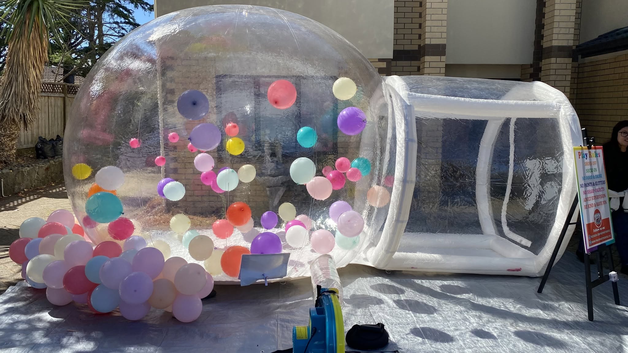 Bubble house with colourful balloons at an Auckland party